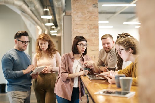 group meeting in a salon with employees discussing plans